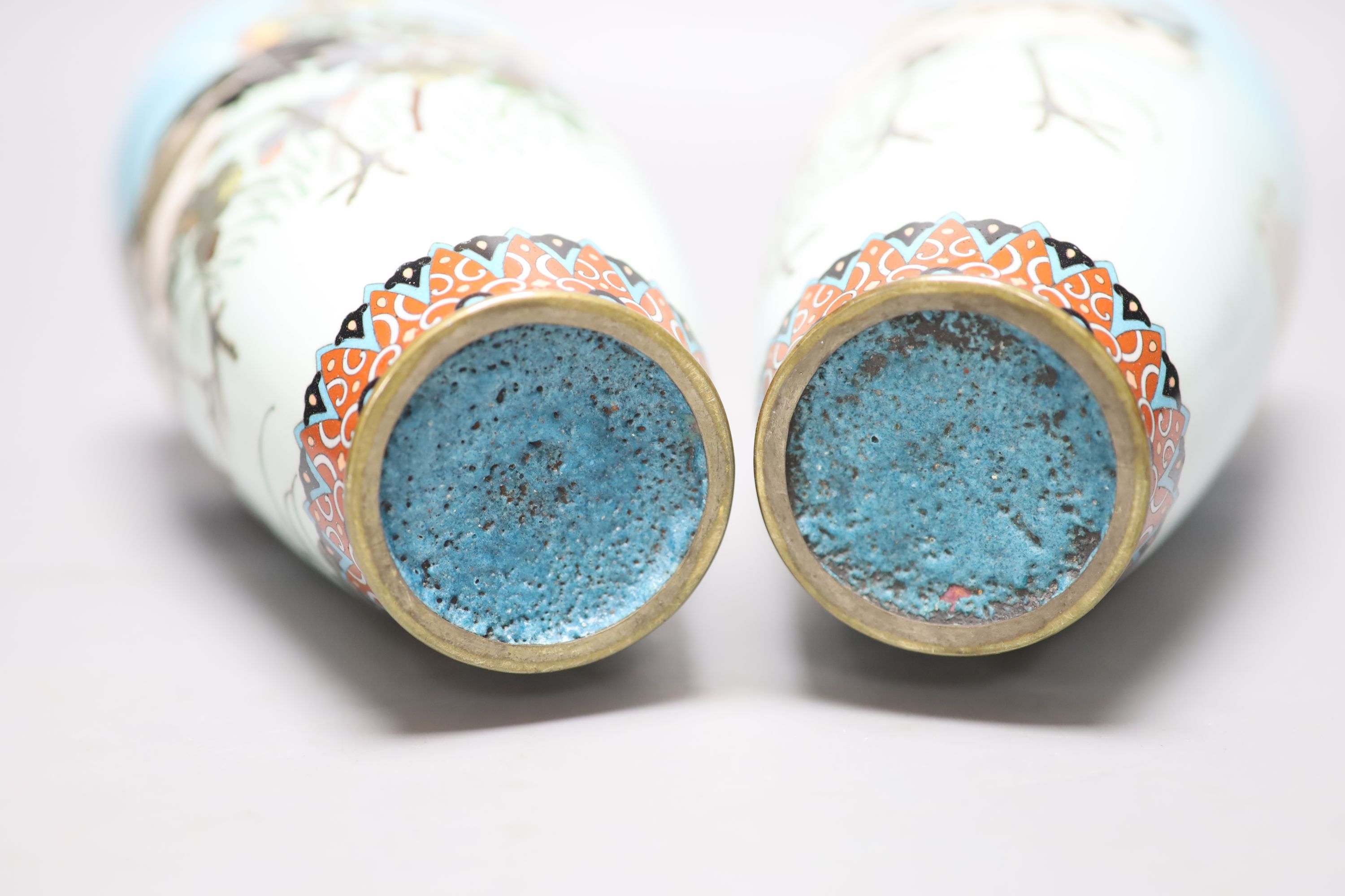 A pair of Japanese turquoise ground cloisonne enamel vases, a large cloisonne bowl and smaller matching bowl, tallest 31cm